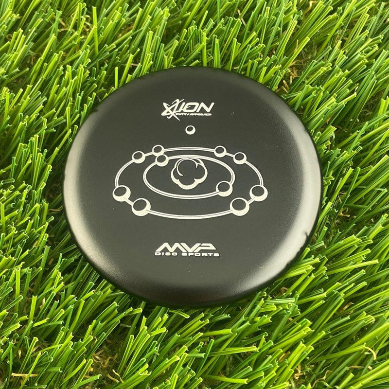 Black MVP Ion disc golf putter with a white cosmic orbit logo and metal flake accents.