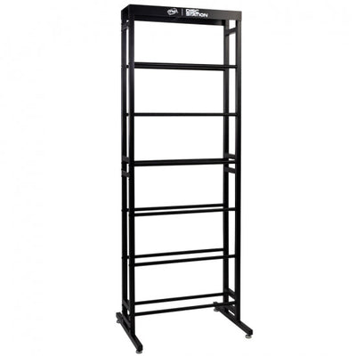 Tall black MVP Disc Station storage rack with six horizontal shelves and stabilizing feet.