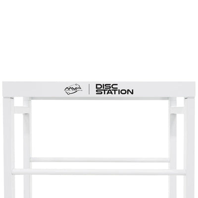 Shiny white MVP Disc Station storage rack with a prominent black logo and text on the top bar.