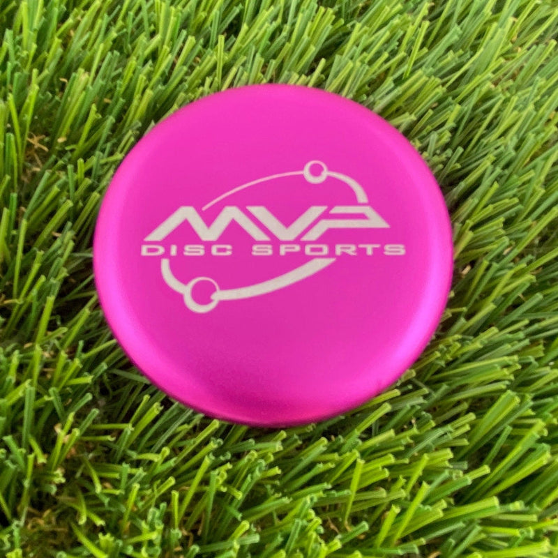 Bright pink MVP Metal Marker Orbit stamp disc golf putter with a white logo and text.