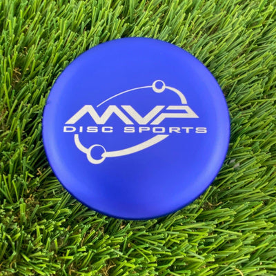 Royal blue MVP disc sports metal marker with a white orbit logo on a flat, circular surface.