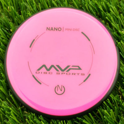 Bright pink MVP Disc Sports Nano Mini Disc marker with dark grey branding and a black rim.