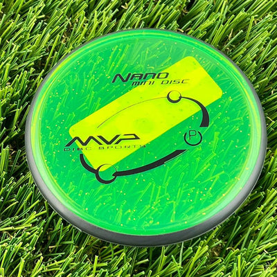Neon green MVP Nano mini marker disc with a dark gray rim and a bright yellow MVP stamp.
