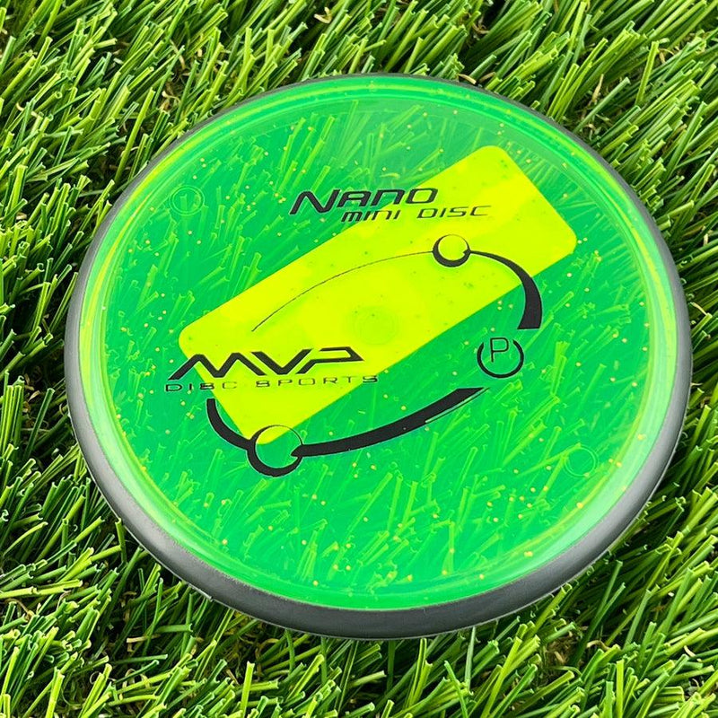 Neon green MVP Nano mini marker disc with a dark gray rim and a bright yellow MVP stamp.