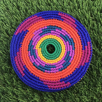 Circular El Grande braided frisbee with bright orange, blue, green, yellow, and purple woven fabric rings.