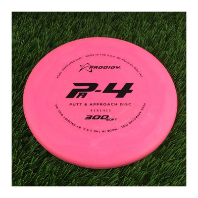 Solid pink Prodigy P-4 Putt and Approach disc with 300 Soft plastic and black lettering across the top.