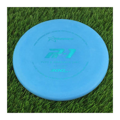 Solid blue Prodigy 300 Soft PA-1 disc golf putt and approach disc with a light blue stamp.