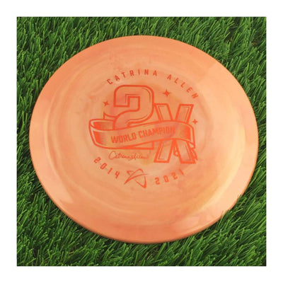 Solid swirl orange Prodigy 400G Spectrum F7 disc with a red Catrina Allen 2X World Champion commemorative stamp.