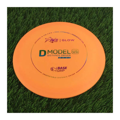 Orange Prodigy Ace Line BaseGrip Color Glow D Model US disc golf distance driver with black and blue text.