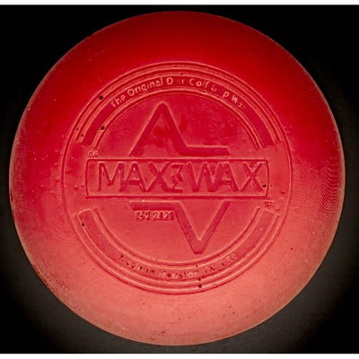 Red circular disc golf grip wax with "maxwax" and "the original disc golf grip wax" embossed.