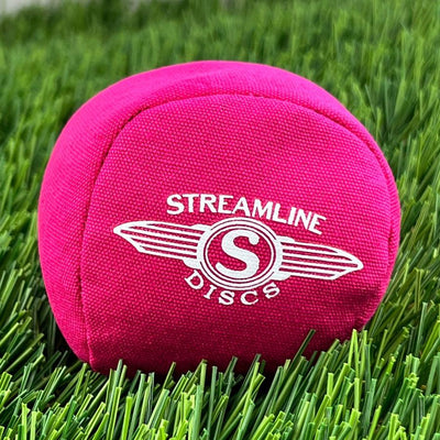 Bright pink Streamline Discs Osmosis Sport Ball Bag with a white "Streamline Discs" logo centered on one side.