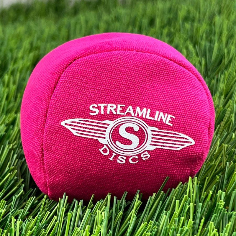 Bright pink Streamline Discs Osmosis Sport Ball Bag with a white "Streamline Discs" logo centered on one side.