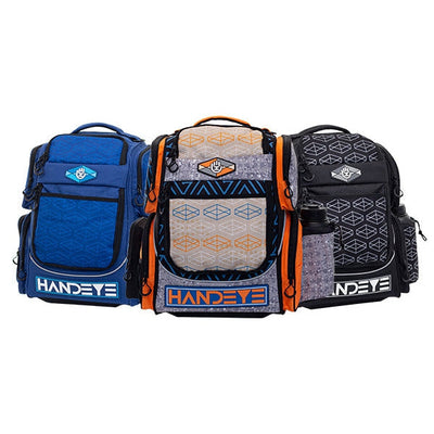 Three handeye mission rig backpacks in blue, patterned grey and orange, and black, displaying geometric patterns.