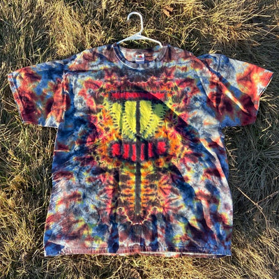Colorful tie-dye Tshirt with a vibrant red, blue, and yellow twisted amanita basket style dysket design on the front.