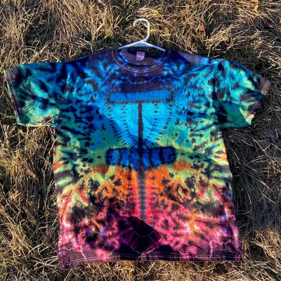 A short-sleeved tie-dye t-shirt displays a dark blue disc golf basket graphic against bright multicolored swirls.