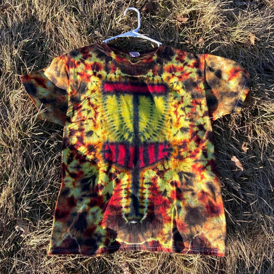 Bright tie-dye t-shirt with a red and yellow disc golf basket design on a warm-toned background of black and orange.