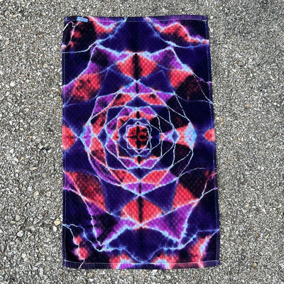 Twisted Amanita tie-dye towel with a vibrant purple, red, and blue mandala pattern, featuring detailed white lines.