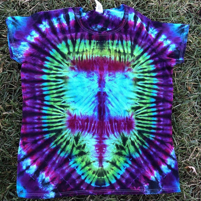 Short sleeve tie dye t shirt for women with a colorful blue, purple, magenta, and green spiral pattern.