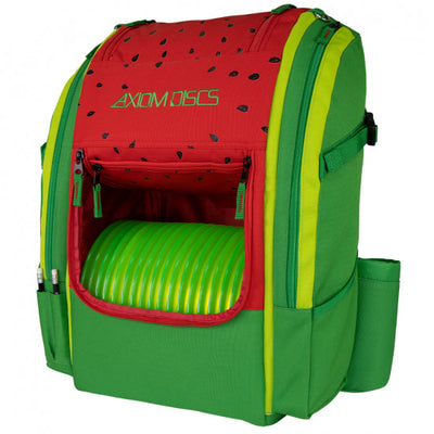 Watermelon-themed axiom voyager backpack, red and green with black seed details, holding lime green discs.
