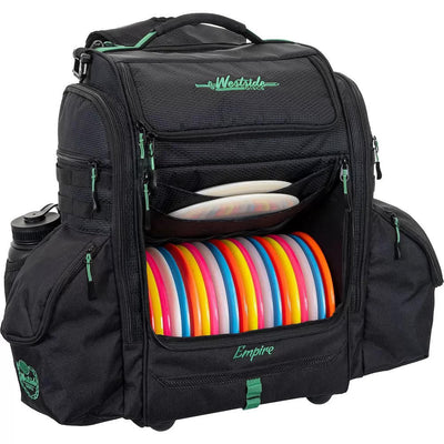Black Westside Discs Empire backpack disc golf bag with colorful discs and green accents and zippers.