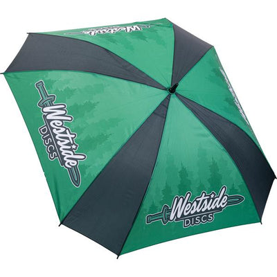 Green and black Westside Discs umbrella featuring a tree line design and the brand logo on two panels.