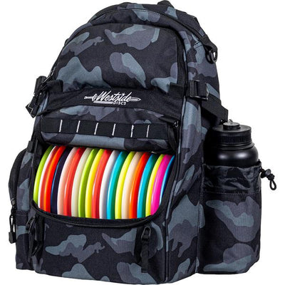 Dark grey and black camouflage Westside Discs Refuge Pack with colorful discs and a black water bottle.