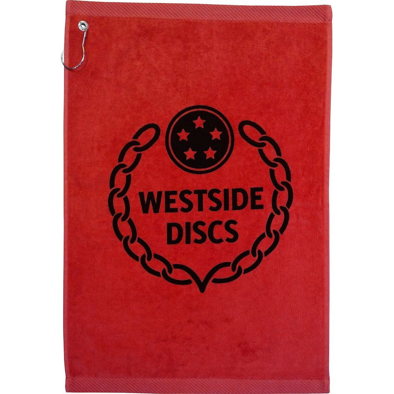 Red Westside Discs towel with black chain graphic and "WESTSIDE DISCS" text, plus a silver grommet and hook.