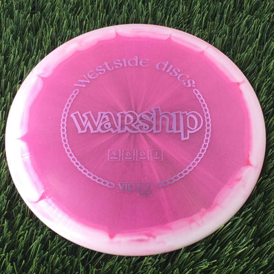 Translucent pink Westside Discs VIP Ice Orbit Warship disc golf mid-range with white swirls and chainlink stamped design.