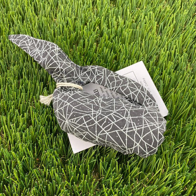 Gray Whale Sacs grip bag with white web-like patterned fabric and an attached product tag.