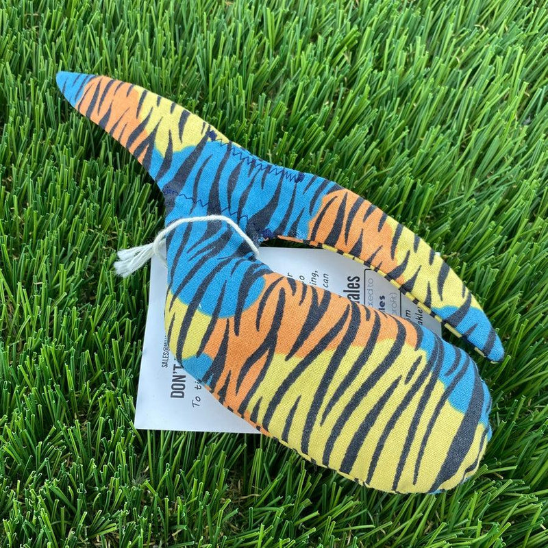 Whale Sacs grip bag with vibrant blue, yellow, orange, and black tiger stripe pattern and a white tag.