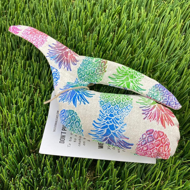 Linen colored Whale Sacs grip bag in a whale shape with multicolored pineapple patterns and a white instruction tag.