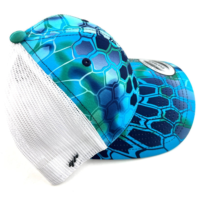 Yupoong Axiom snapback trucker hat featuring a blue and green Kryptek camo pattern with white mesh back.