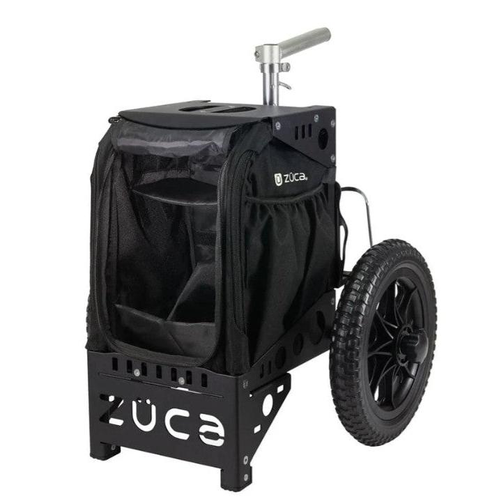 Black ZUCA Compact Cart with a sturdy metal frame, a fabric storage compartment, and one rugged wheel visible.