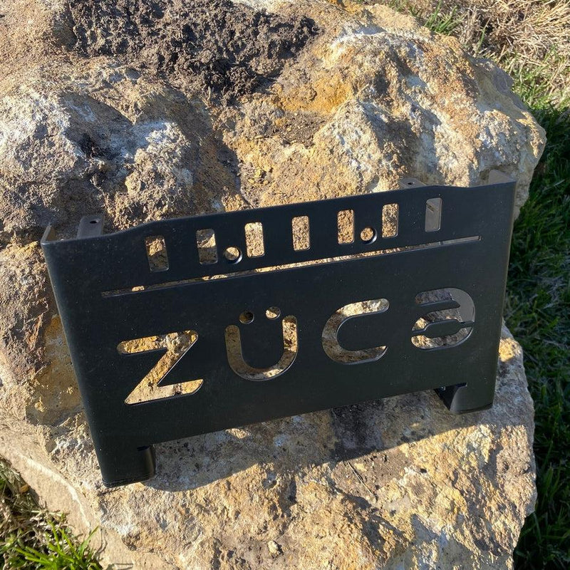 Black ZÜCA cart front wrapper with cut-out letters and slots detailed across the top.