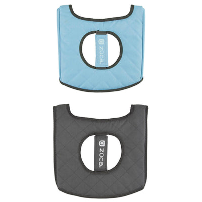 Two Zuca Cart reversible seat cushions, one light blue and one dark gray, both quilted with a large cutout in the center.