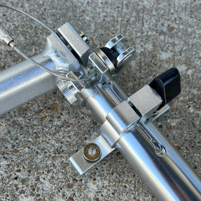 Silver Zuca Cart telescoping handle set with shiny metal tubes, clamps, and a black handle bar.