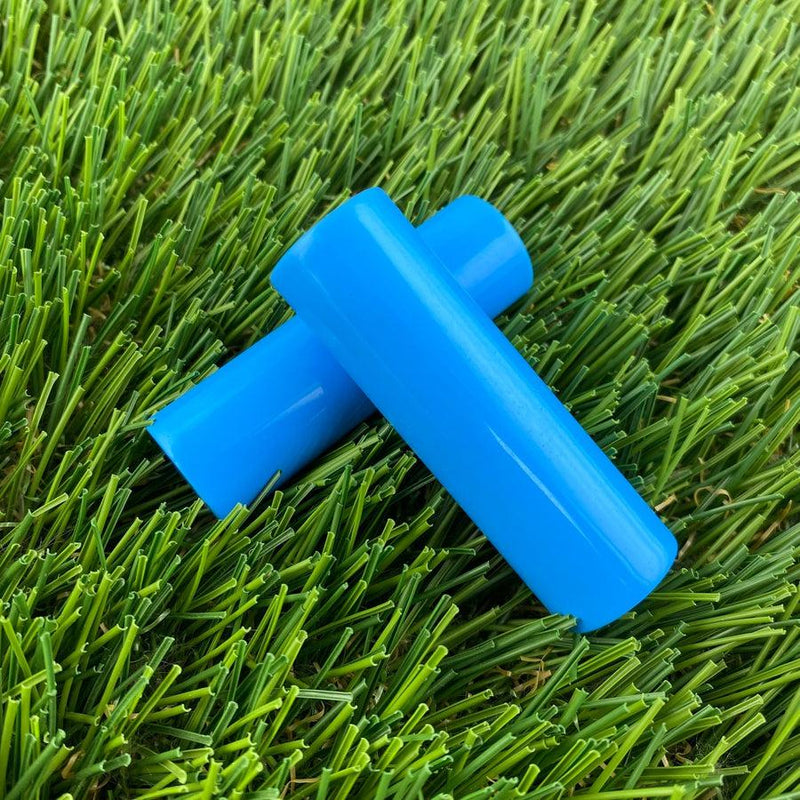 Two bright blue ZUCA cart wheel spacers featuring a smooth, glossy finish are positioned diagonally.