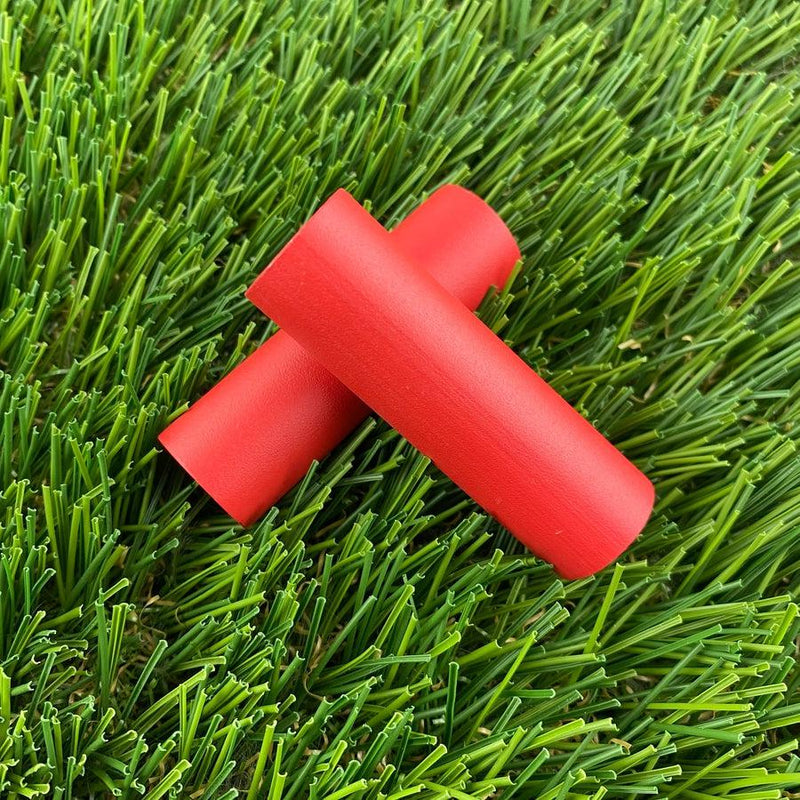 Two crimson red ZUCA Cart wheel spacers made of durable plastic are shown overlapping each other.