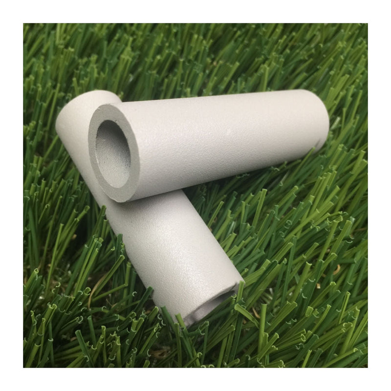 Two light gray Zuca cart wheel spacers made from textured cylindrical plastic with hollow centers.