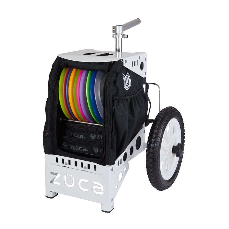 White ZÜCA Compact Paul Ulibarri disc golf cart with black bag, colorful discs, an extendable handle, and white wheels.