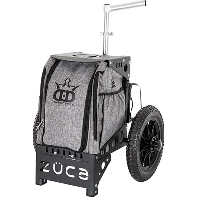 A ZÜCA Dynamic Discs Compact Cart features a gray fabric bag, a black aluminum frame, and rugged black wheels.