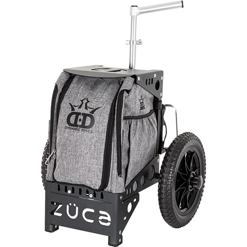 A ZÜCA Dynamic Discs Compact Cart features a gray fabric bag, a black aluminum frame, and rugged black wheels.