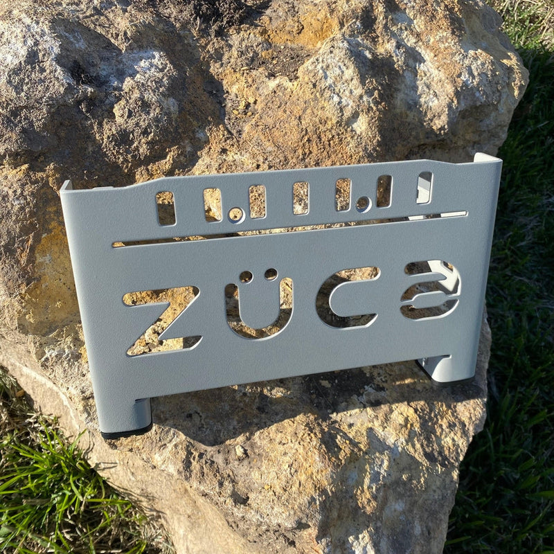 Gray ZUCA cart front wrapper with the ZÜCA logo cutout and multiple rectangular slots.